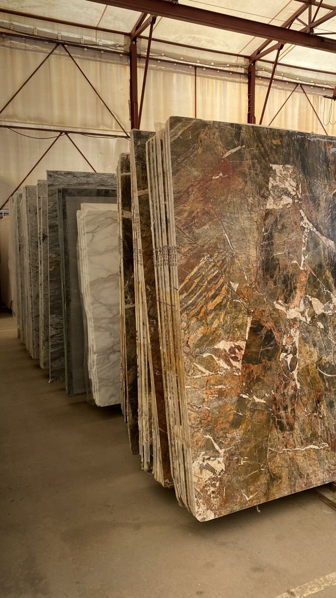 Slab bundles racked by lot number at the Royale Quartz Dallas warehouse